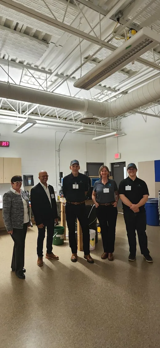 Five participants standing together during the 2025 Better Pools Workshop